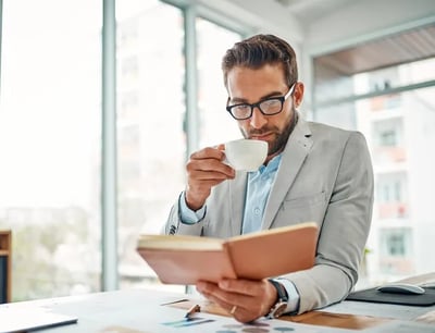 Man-coffee and book